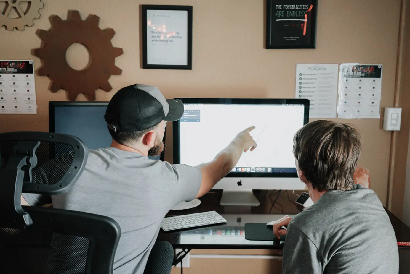 Two people working at a computer